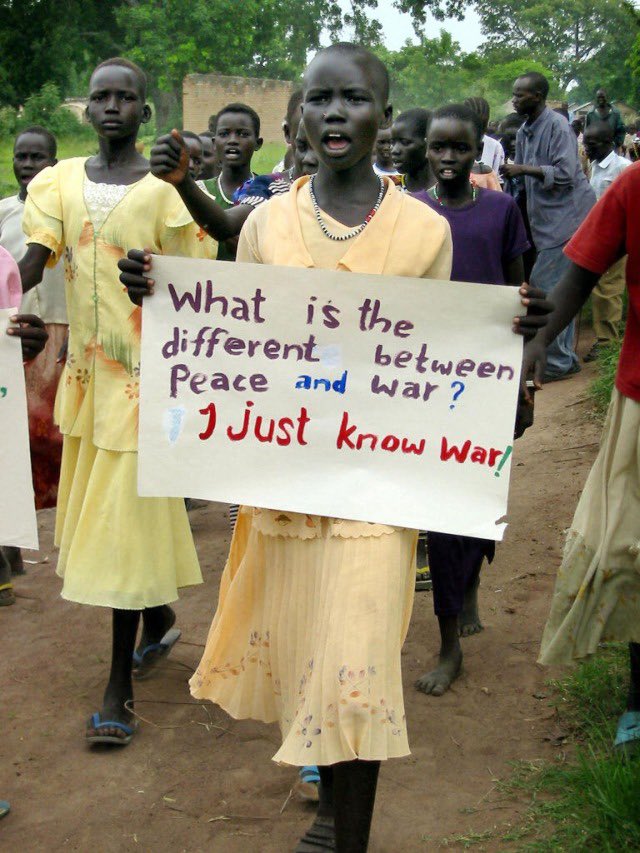 yasishraqi's tweet photo. A Sudanese girl holds a sign as supporters of Sudan People's Liberation Army leader John Garang wait for his arrival on the tarmac of the Rumbek, south Sudan, airport.

Photographed by Beatrice Debut. 10 June 2004.

#sudan https://t.co/E7Q9TcH6LF