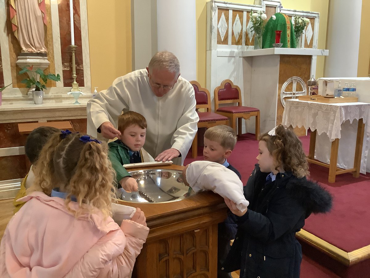 We went to church.  We role-played a Baptism.  We learned about some of the words spoken and the special signs and symbols such as the white garment, candle, shell and font.  We talked about some of the special people present.