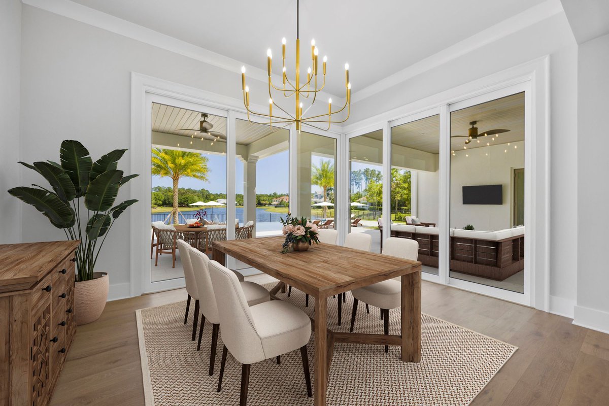 Every meal is that much more enjoyable with pool-to-lake views at DreamDesign®67. #starrcustom #dreamdesign #dreambuilder #designbuild #custombuildersinjacksonville