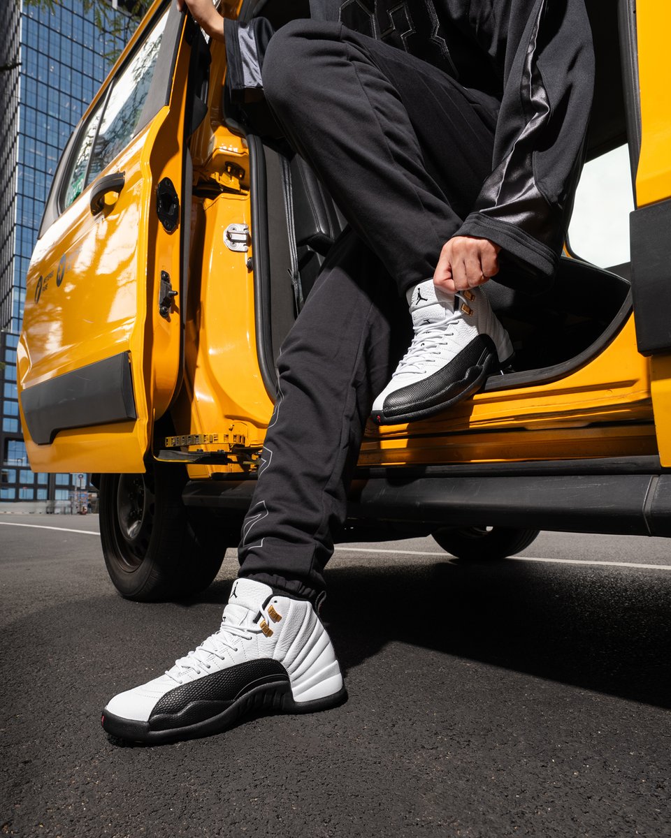 jordan 12 black and yellow on feet