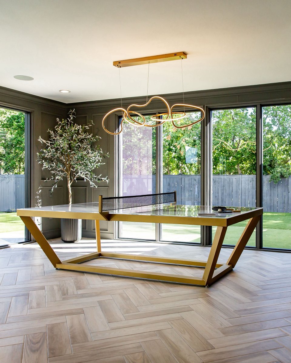 Explore the elegance of our Vitro Table Tennis Table, shown here at the Calibu Vineyard with a brass finish and a lucite play surface.

#pingpongtable #tabletennis #gametable #interiordesign #luxuryinteriors