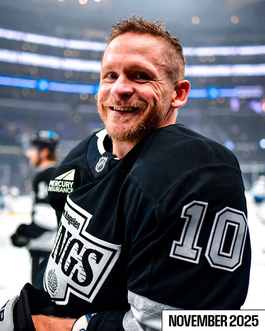 Corey Perry smiles for a photo during warmups in 2025. 