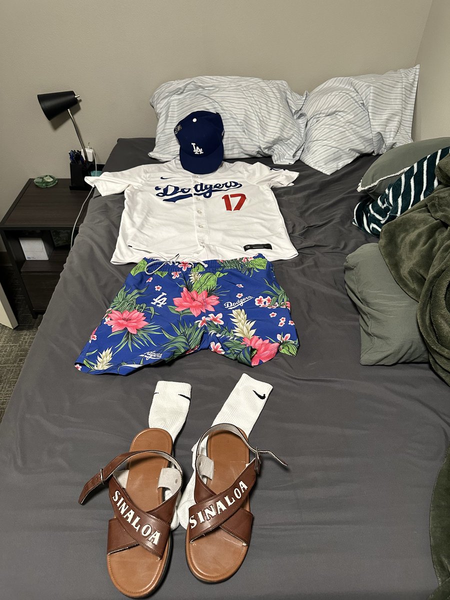 Sleeping next to my game 1 of the #worldseries fit like it’s the first day of school tmrw