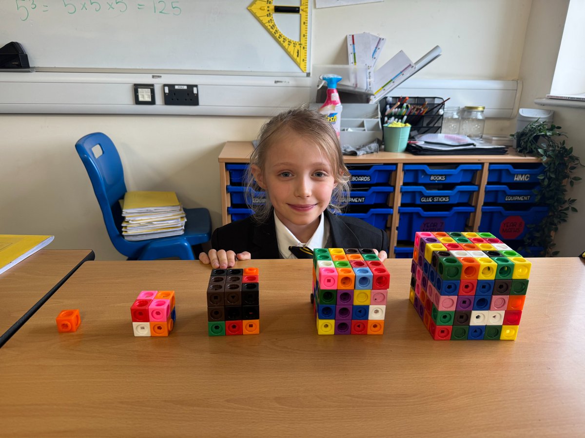 This week Mrs McCann’s class looked a cubed numbers and proved why we multiply by itself and itself again, by using multi link cubes! Do you know what 5 cubed is? The class would tell you that “it means 5 x 5 x 5 which makes 125! 125 small cubes make the big 5 by 5 by 5 cube!”
