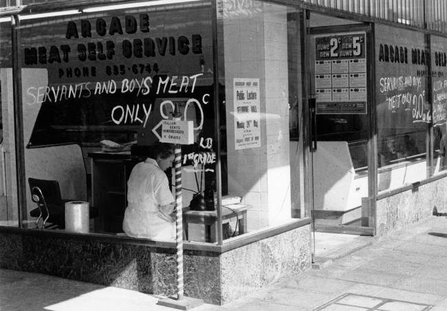 HistorySAZAR's tweet image. This is a photograph of a butcher shop in Johannesburg,  taken in May, 1965. They advertised second grade meat, which is sold at a lesser price, bought mostly by Black people. Image Source: Flashbak