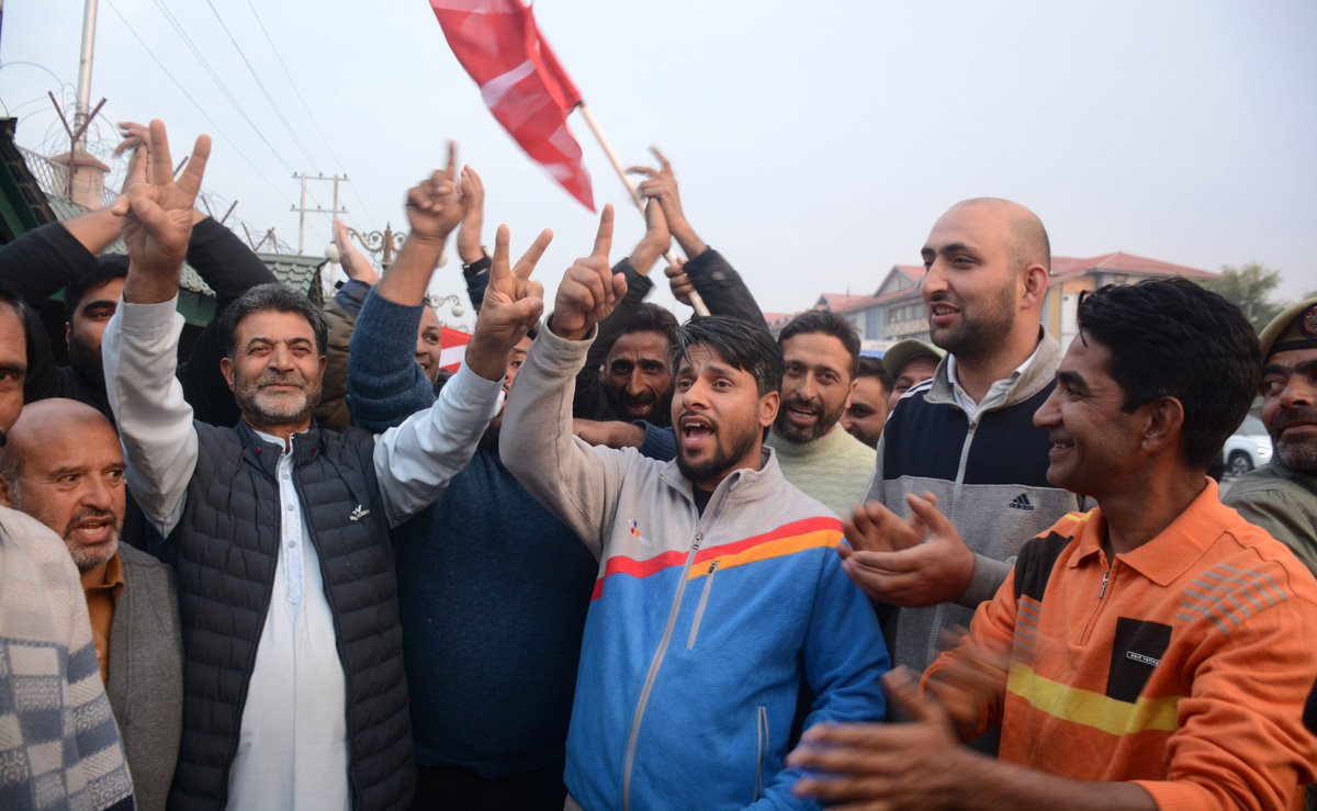 National Conference workers and supporters wave party flags and flash victory signs while shouting slogans outside the counting centre after the party’s win in all three Rajya Sabha seats, in Srinagar on Friday.

Photo: KM / Umar Ganie