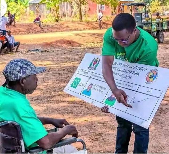 Tanzania electoral commission teaching voters on how to vote
