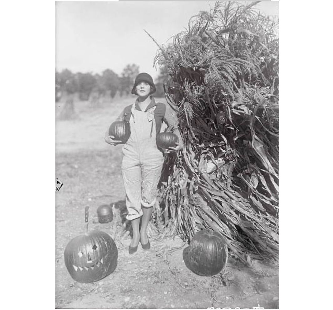 Oct. 24, 1925: “Vivian Marinelli, pretty Washington debbie, making ready for the Halloween party which she is to give next week. Of course, no Halloween party could be complete without the pumpkins, the witches and the goblins.” (International News Service)