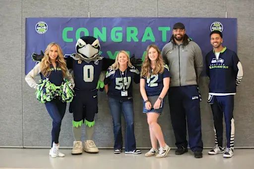 Some <a href="/Seahawks/">Seattle Seahawks</a> recently visited <a href="/MountainMiddle/">Mountain View Middle</a> to celebrate 7th grader Kyla K. as the top reader in the "12 Pages Summer Reading Challenge, logging 13,026 minutes of #reading! Kyla earned a custom Seahawks jersey, a game day experience, and special school visit from the team.