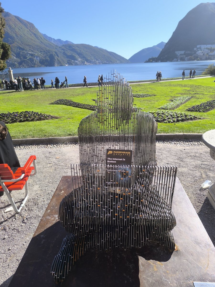 Satoshi reading Passphrase Magazine <a href="/LuganoPlanB/">Lugano Plan ₿</a>