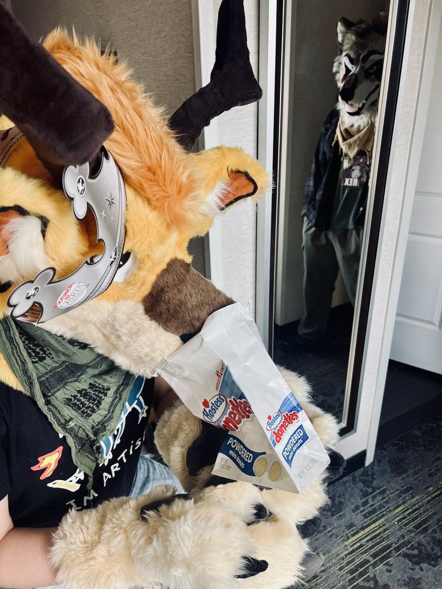 Oh no! He got into the powdered donuts 🥵 

#fursuitfriday