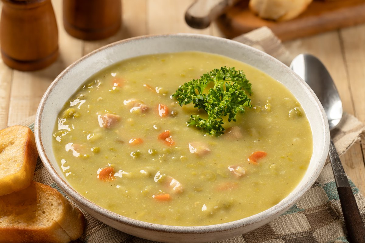 Canada's tweet image. There’s nothing more comforting on a cool fall evening than a warm, cozy bowl of soup. Our top pick? Split pea soup! Made from split peas, ham and veggies, this hearty soup was invented in #Quebec but is enjoyed from coast to coast.  What do you like to cook on a cold day?🫛🍲