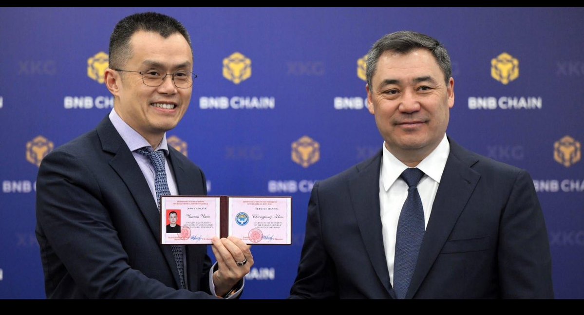 CZ Binance with Kyrgyz President holding advisory certificate at BNB Chain event