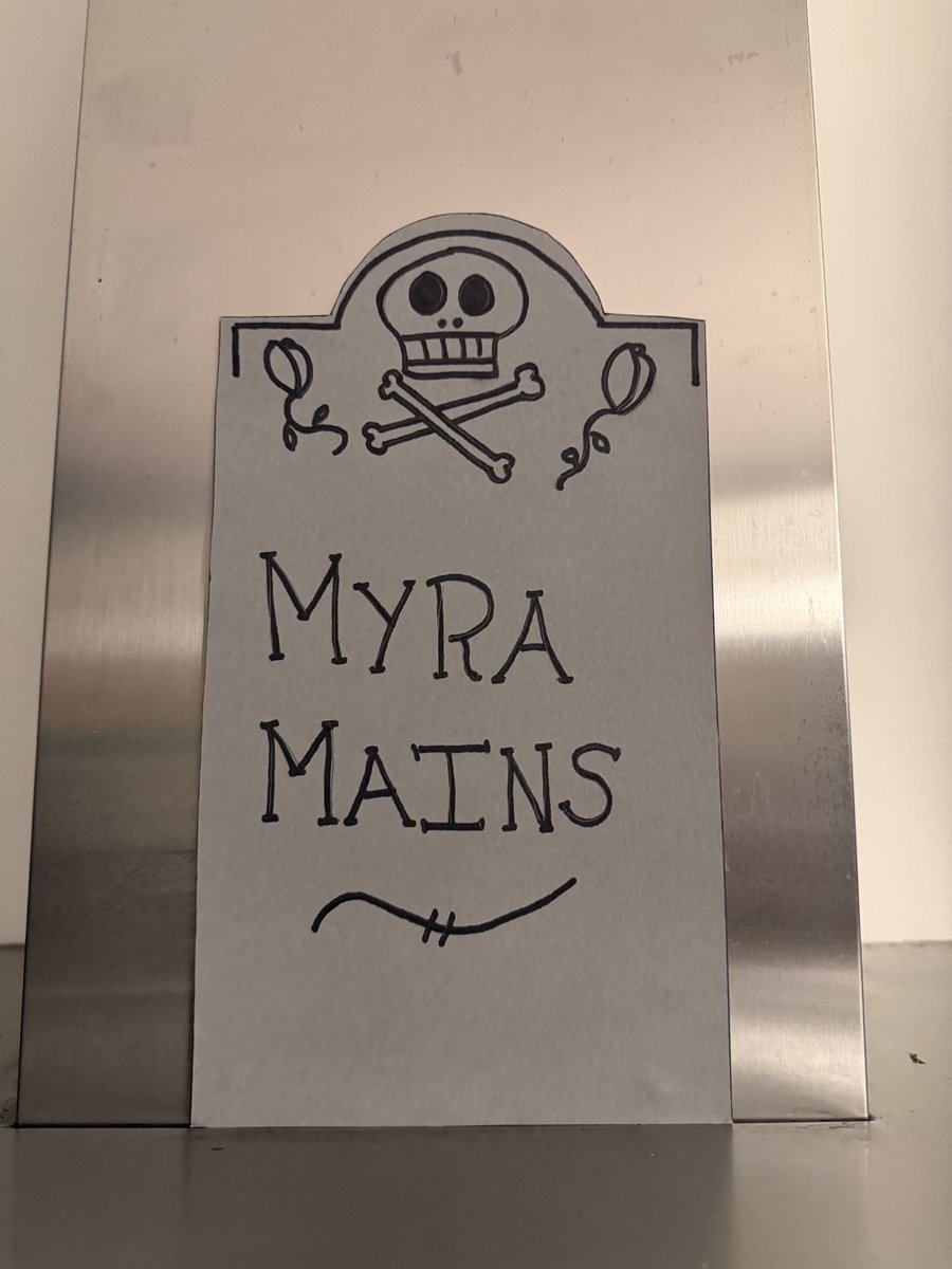 david_h0s's tweet image. My wife cooking with the Halloween decorations.