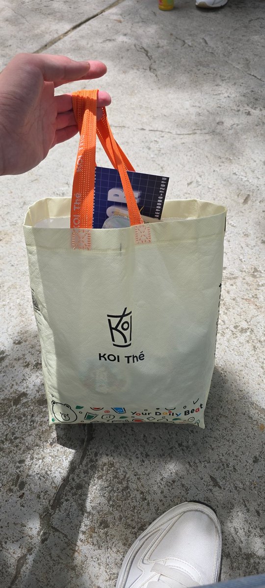 I'm at the taman opposite merchandise area, can spot me with the koi bag.