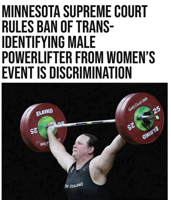 A headline text overlay reads Minnesota Supreme Court rules ban of trans-identifying male powerlifter from womens event is discrimination. Below it, a person with short hair wearing a black tank top and red shorts lifts a barbell loaded with red and green weight plates overhead in a sports competition. The background includes a blurred audience and a banner with New Zealand text. Gold Coast branding appears on the weights.