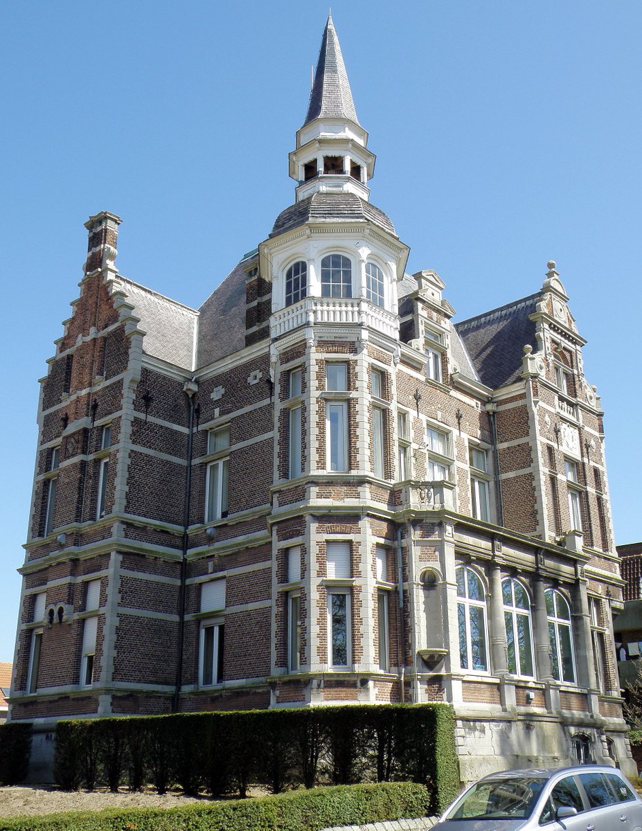 dutchbuildings's tweet photo. A villa in #Ekeren (Antwerpen) called "Hof Mertens", built on a square plan in 1884 by Clement Mertens, designed by H. Blomme. It is a two-story brick building in Flemish neo-renaissance style with slate roofing, featuring stepped gables, natural stone elements, and varied window types. It includes a polygonal tower with an inset spire and a round tower with a conical roof, an oriel with arched windows, and an arched door with a porch at the north facade.