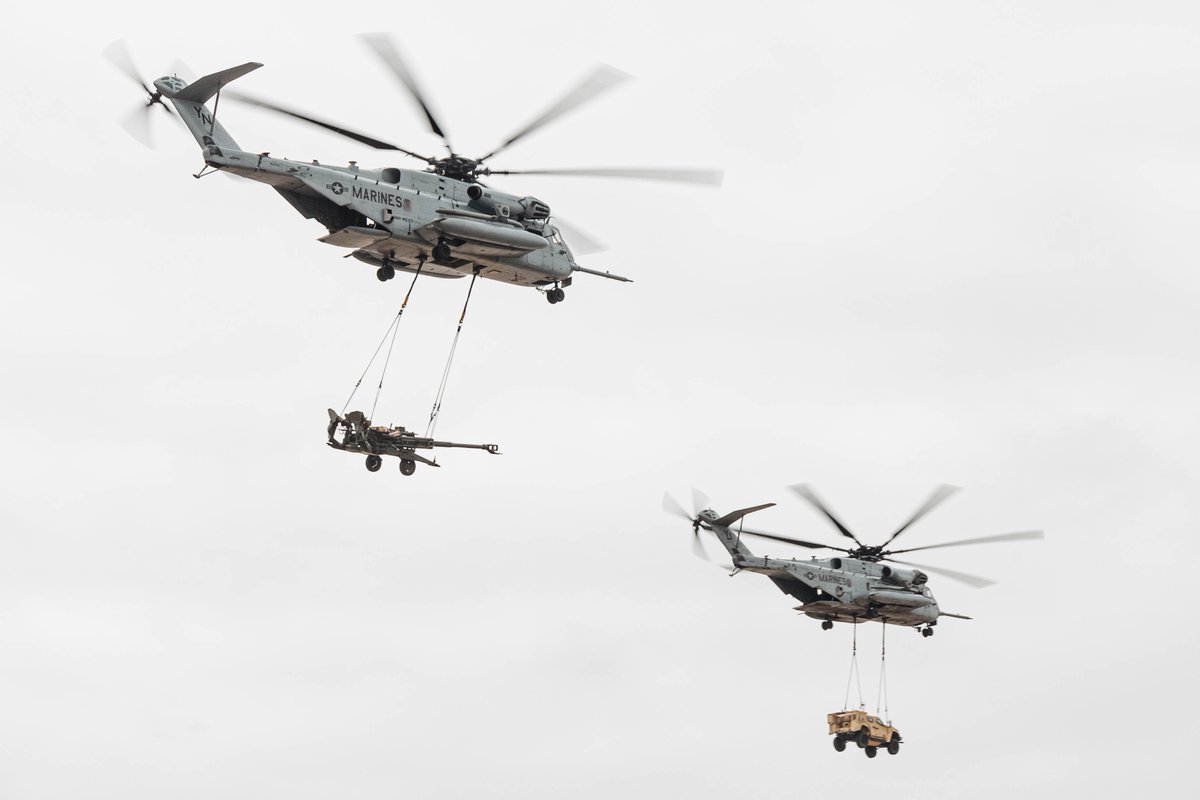 Proceedings Photo of the Week: Marine Corps CH-53E Super Stallion helicopters lift an M777A2 howitzer and a Joint Light Tactical Vehicle during the 2025 Marine Corps Air Station Miramar Air Show in San Diego. Marine Corps (Sarah M. Grawcock)