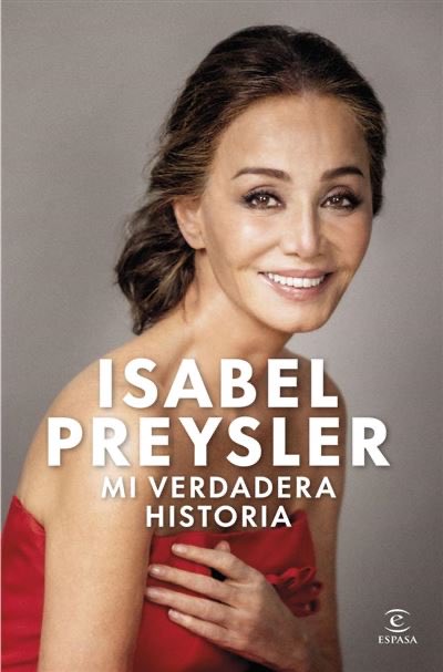 Portrait of Isabel Preysler a woman with long brown hair smiling while wearing a red strapless dress her hands crossed over her chest against a gray background with overlaid text Mi verdadera historia and her name.