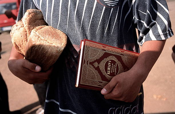 ShaljanBajgores's tweet image. Flight and Expulsion of Albanians from Kosova 

Refugee camp in Kukës, Albania📍 

Bread and a Quran in the hands of a young Albanian boy who, together with the rest of his family, was herded into trucks like animals by Serbian units and expelled to Albania in 1999