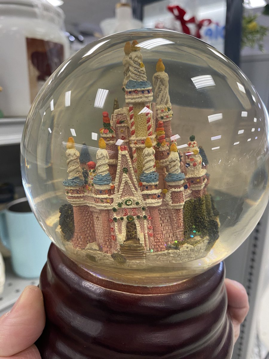 The holy grail of Goodwill finds. Disney World cake castle snow globe for $5!!