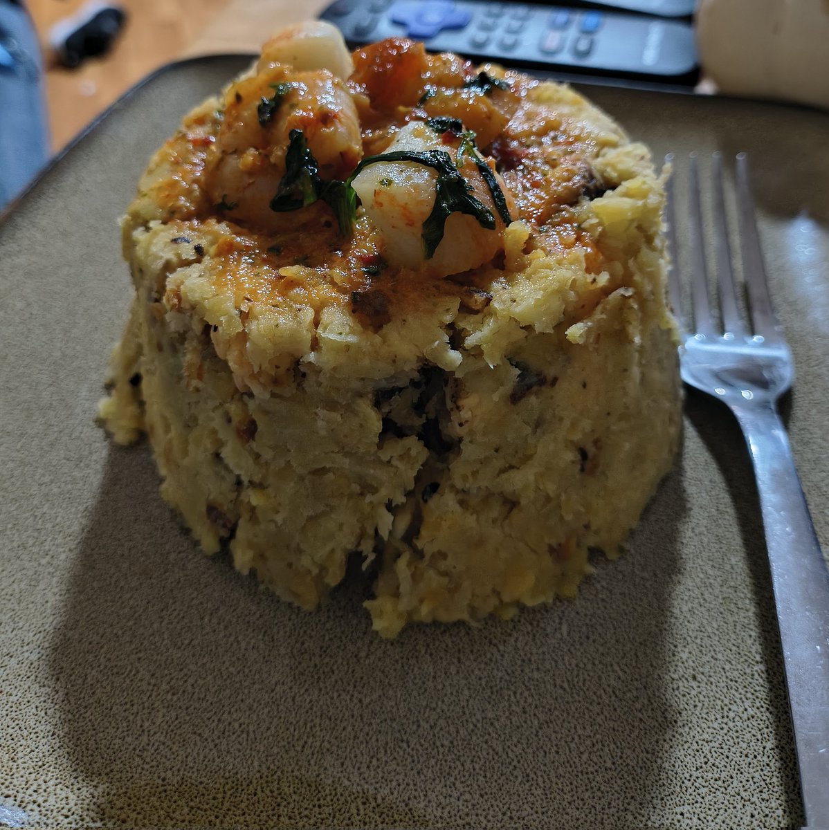 My wife made seafood mofongo with Creole sauce