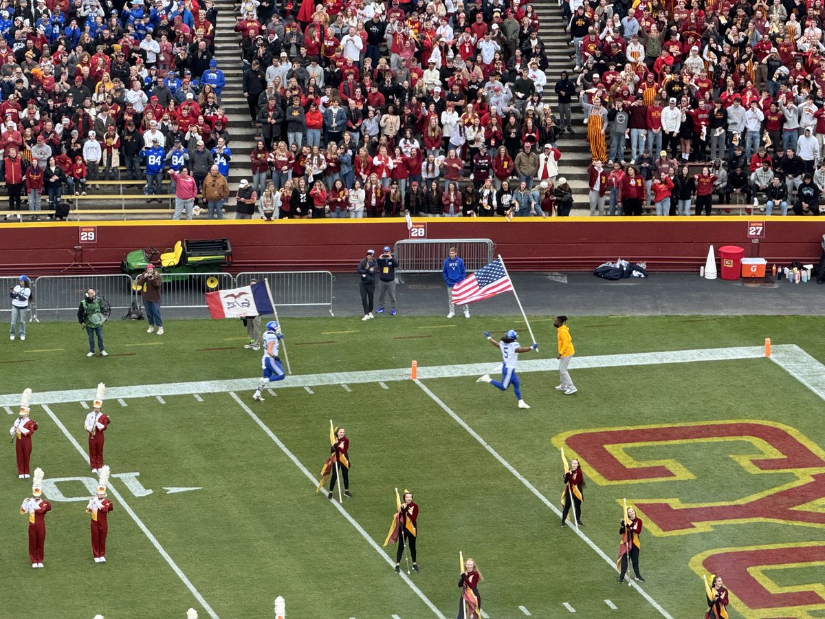 williamseals's tweet image. BYU player takes the field with a State of Iowa flag. #respect