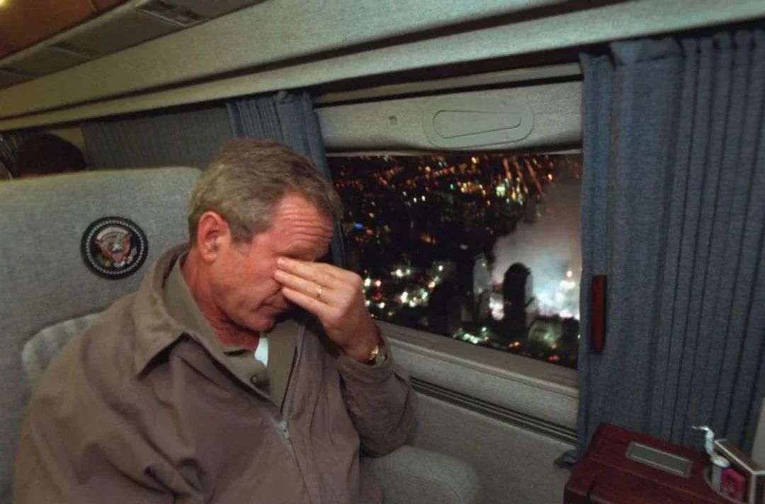 fasc1nate's tweet image. George Bush flying over the remains of the Twin Towers, 9/14/2001.
