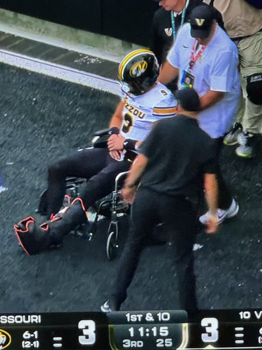 Mizzou QB Beau Pribula being taken off in a wheelchair