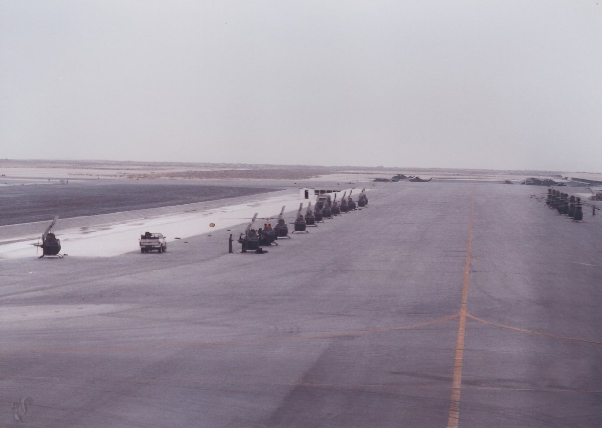 Mach3Plus's tweet photo. Rows of Army helicopters lined up on a taxiway surrounded by nothing but sand. Just waiting on the word to launch. The scale of the buildup was unreal out there. #DesertShield #DesertStorm https://t.co/g7pH2rgmT5