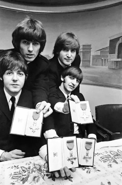 Exactly 60 years ago today, The Beatles were awarded MBEs by The Queen. “‘It was quite funny,” said John Lennon after. “But she was sweet. I think she seemed a bit mumsy to us because we were young boys and she was a bit older.”
