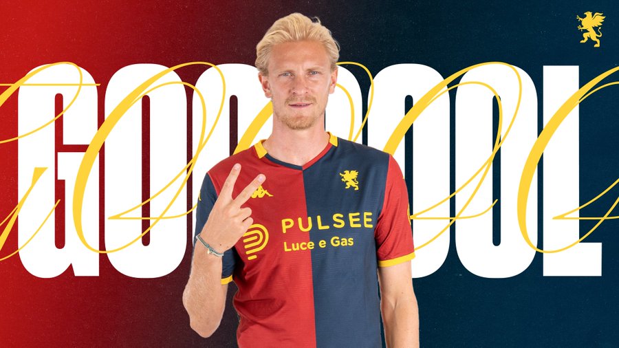 Morten Thorsby, a blonde male athlete, stands smiling and making a peace sign with his right hand. He wears a red and blue Genoa CFC soccer jersey with yellow accents and sponsor Pulsee logo on chest. Background features red and blue gradient with yellow Genoa griffin emblem. Gold text GOOOOOL curves around him.