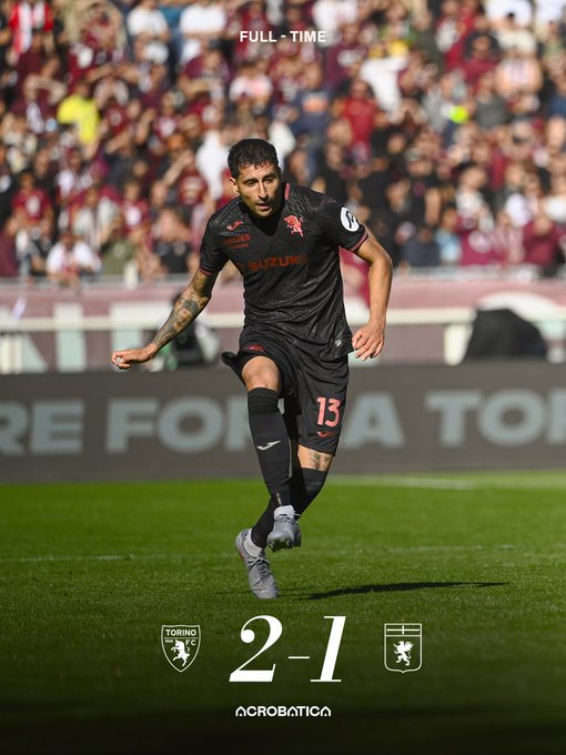 Player number 15 in black Torino kit with red accents and tattoos visible on arms runs dynamically on green soccer field during match, stadium crowd in background, full-time score 2-1 Torino vs Atalanta displayed at bottom with sponsor Acrobanca logo.