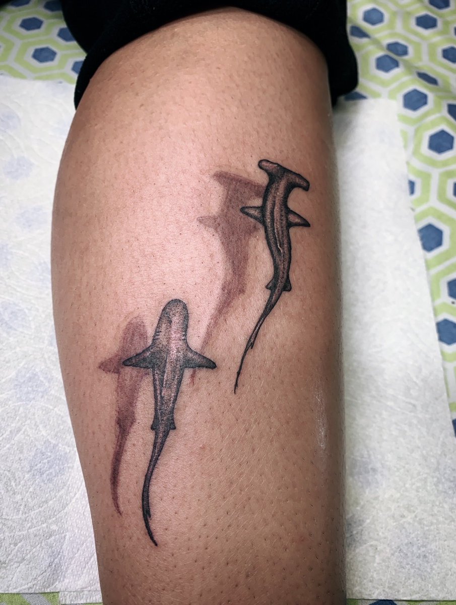 MarshallEStokes's tweet photo. Tattoo of two sharks with drop shadow #tattooartist https://t.co/ajii6sfFCW