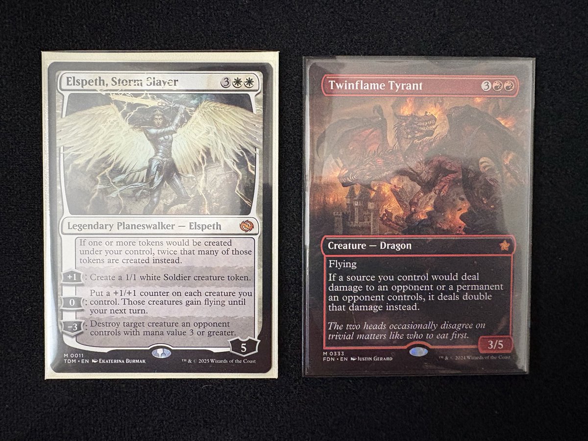 Spending the day organizing my Magic collection. Been playing a little over a year now — here are my two most valuable cards, each worth about $30. Both were pulled from play boosters.