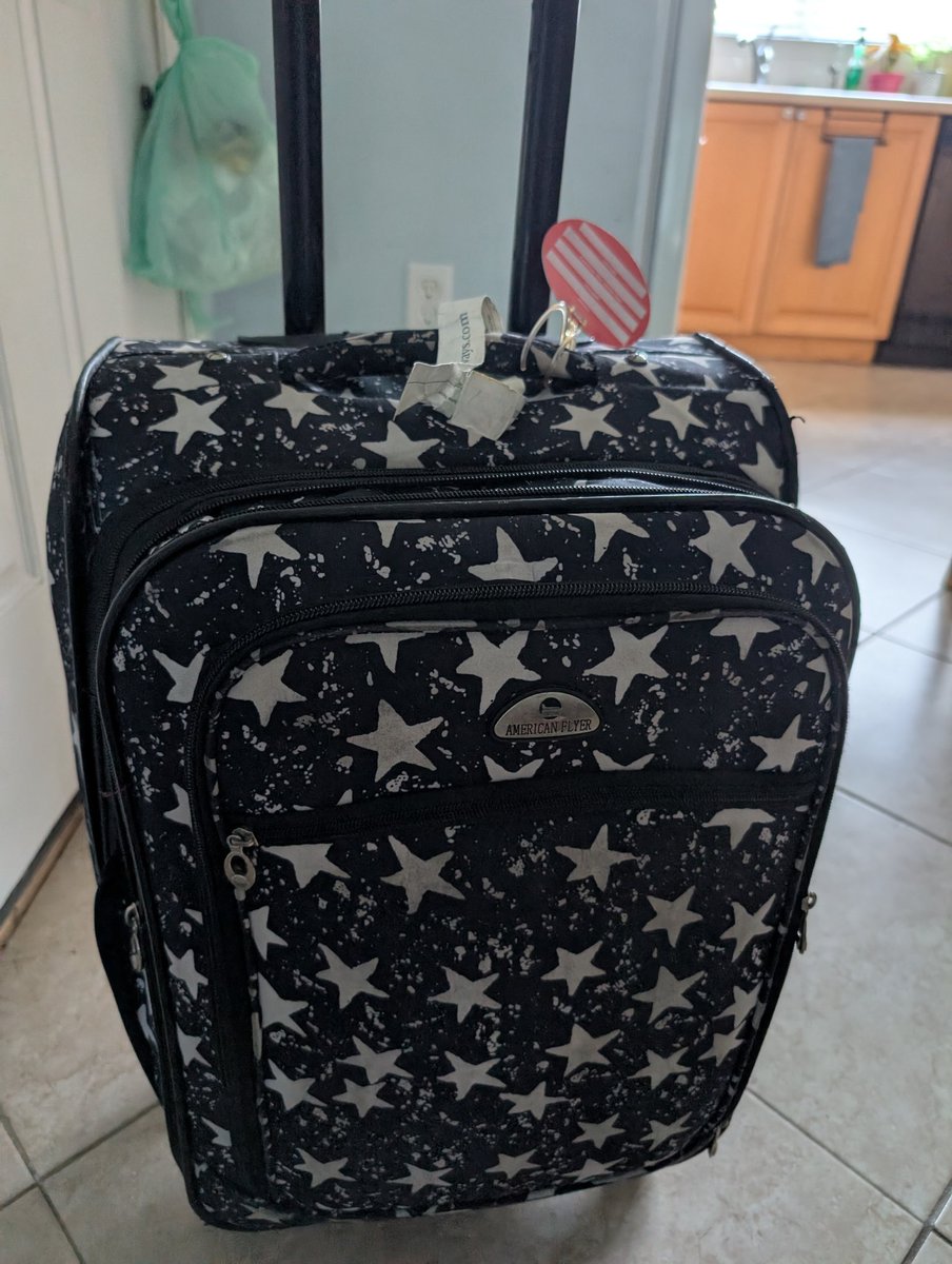 DeeBlackman's tweet photo. @AmericanAir My suitcase is quite unique, please can the camera footage be checked... https://t.co/lYook3ivz6