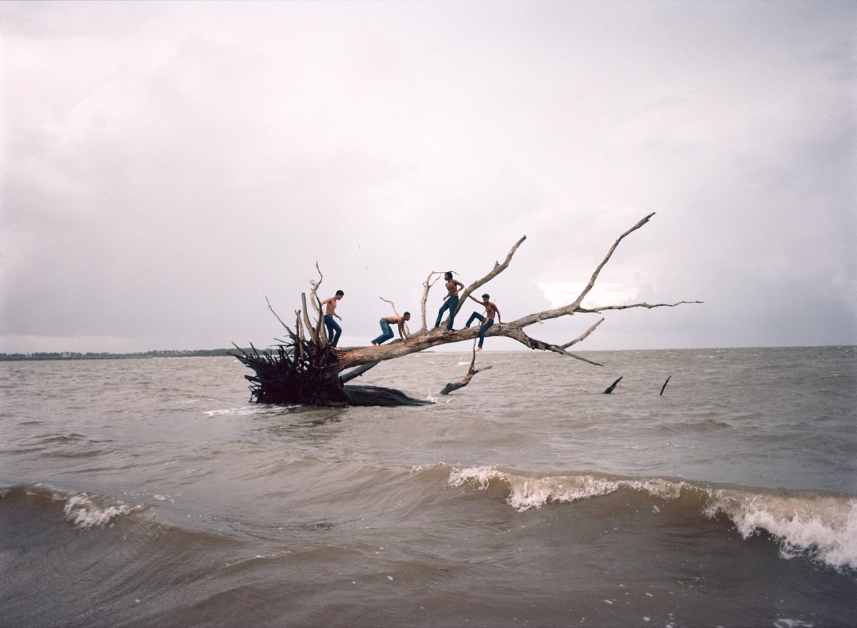compositioning's tweet photo. Florida Boys by Josh Aronson (2020–2025)

This series by Miami-based artist Josh Aronson documents groups of young men, many of which are first-generation Americans, as they travel through Florida’s range of environments. Merging documentary and constructed photography, the series explores identity and intimacy across swamps, dunes, rivers and beaches.

Aronson conceived the project as a response to Florida’s dual mythology of both paradise and decay, referencing both its colonial and contemporary histories. Through staged collaboration, Aronson depicts male friendship as both performance and escape, framing the Florida landscape as a site of vulnerability.
