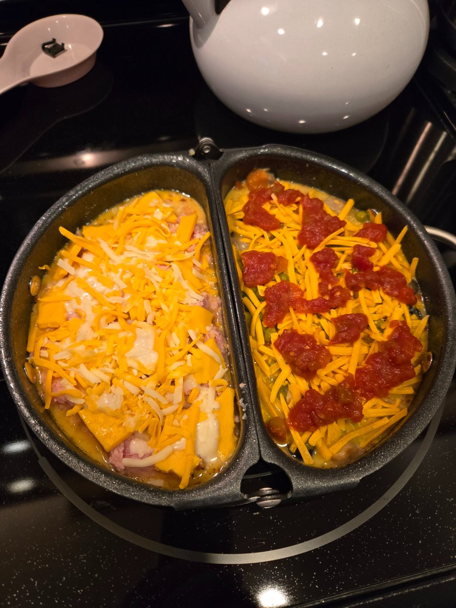 This, Ladies and Gentlemen, is how to make a first class omelet! The hinged omelet pan is key!  3 eggs, milk, onion &amp; garlic powder, cumin, chipotle Tabasco, salt, pepper, Chunk ham, 4 cheeses, minced dried onions, black olives, mushrooms and a few green peas, some ranch dressing