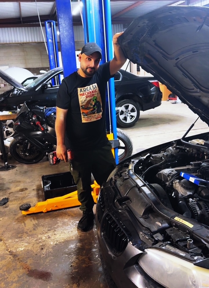 animationsaurus's tweet image. Gaith wears our Area 51 Mechanic Shop tee to work! Visit his Euroline Autowork LLC, a real mechanic shop located on North Lamar in Austin, Texas. Get your T-shirt today at RoswellAliensStore.com. 👽 #Area51 #alieninvasion #aliens #merch #mechanic #autoshop #austin #texas