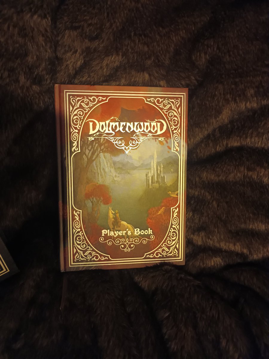 JacobOdd1's tweet photo. I did go for one of the higher tiers, so the hardback rulebooks came in a faux leather sleeve with a great goat (Breggle) silver inlay, a cloth map and four small hardback adventures (reminiscent of childhood Ladybird fairytale books). https://t.co/nvdKLVrD34