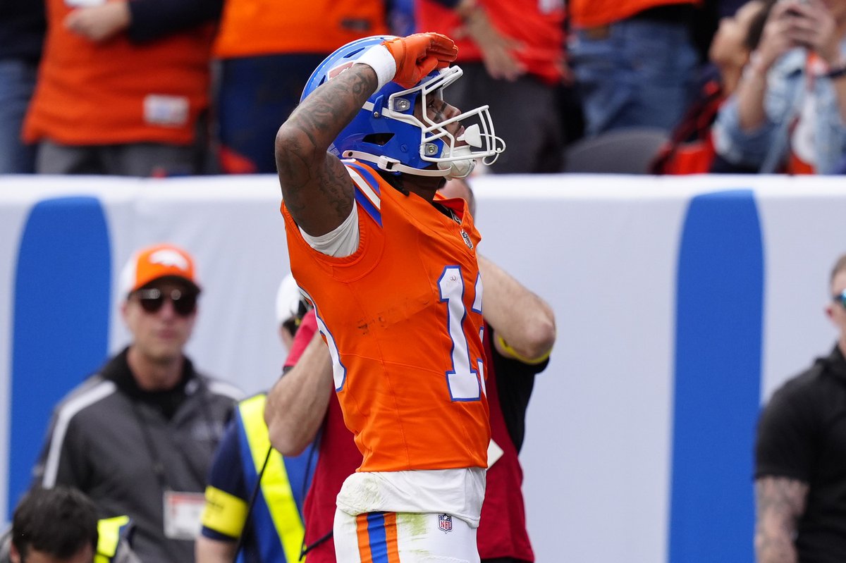 Pat Bryant hit the Mile High Salute after scoring his first NFL touchdown.