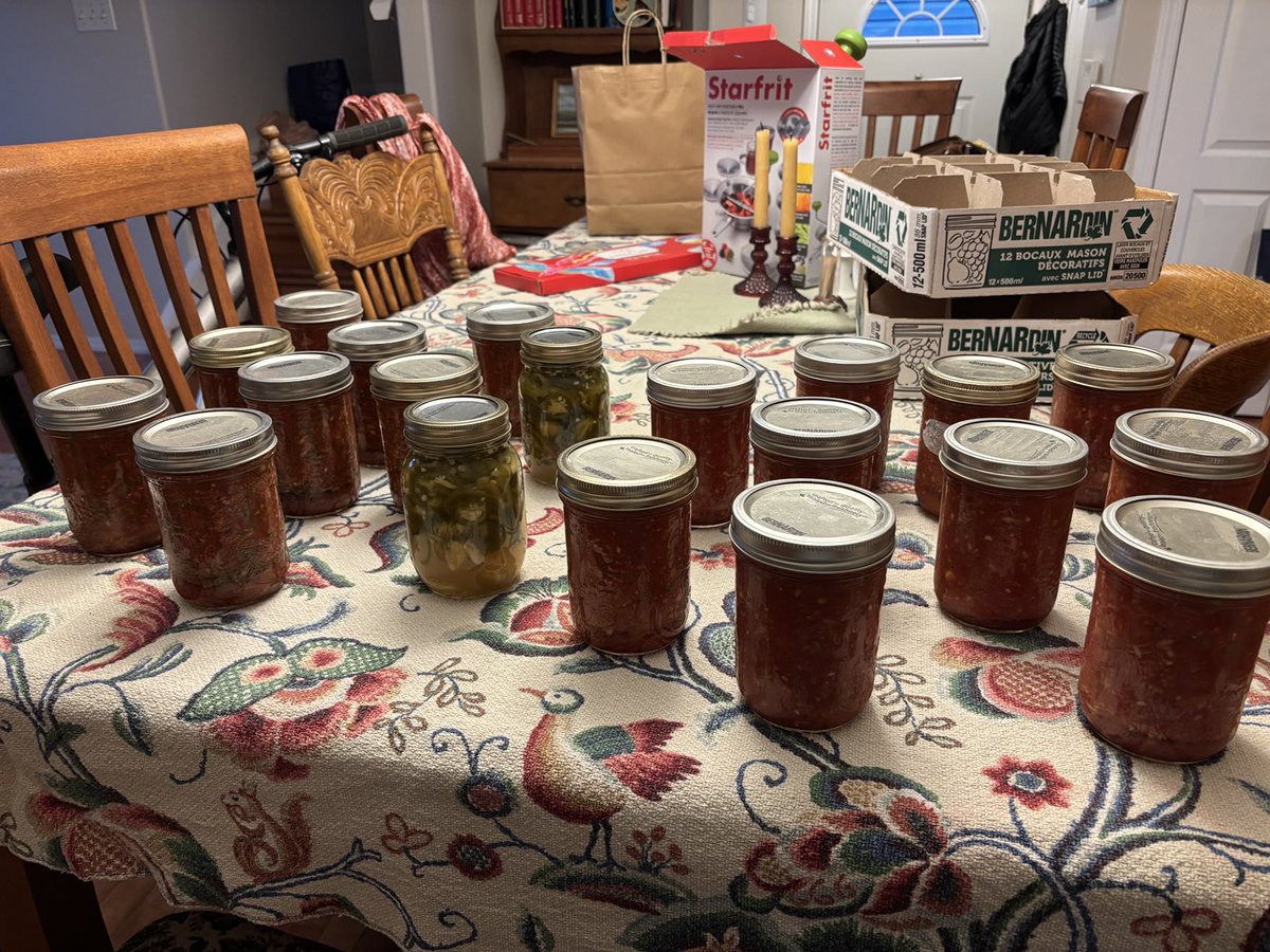 Salsa making/canning day!! 18 jars from our homegrown tomatoes and garlic and farmers’ market peppers and onions. (Plus two jars of pickled jalapenos because we had extra). Should get us through.