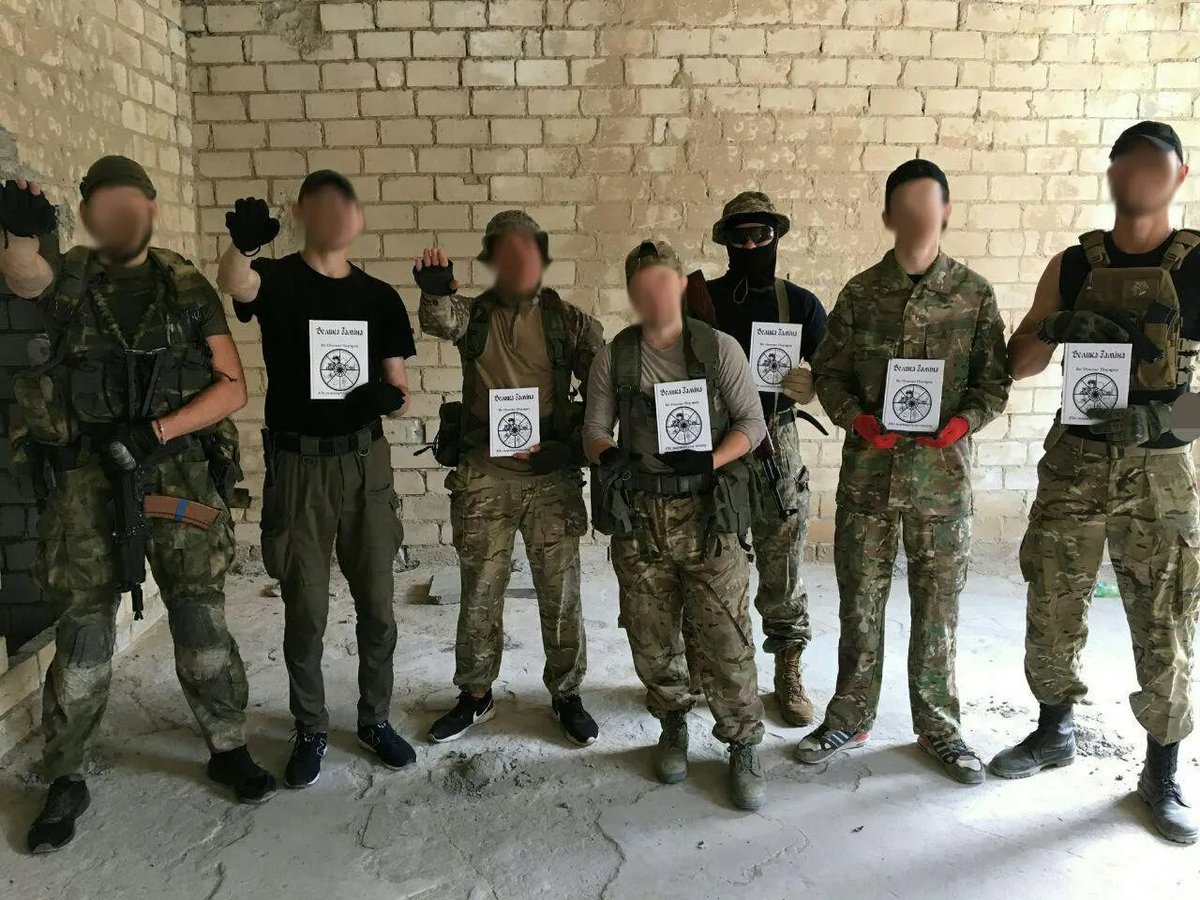 ukrainian soldiers posing with translated copies of the christchurch shooter's manifesto, c. 2019