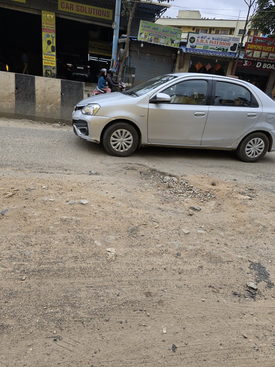 Joy_networkz's tweet photo. The road from Alpine Eco to Brookefield has been full of potholes for months — not a single one fixed! 🚧 People take huge risks daily. Reporting feels like a joke; no action ever taken. Please fix this and save our #NammaBengaluru 🙏 #BengaluruTraffic #BBMP https://t.co/11qB19LGr9