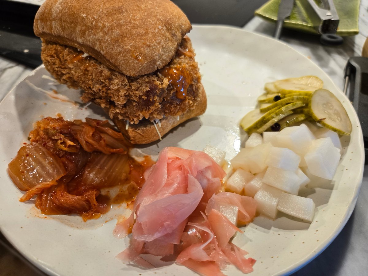 David89083011's tweet photo. Tonkatsu burgers w/ various pickles. Hurrying to catch an early flight to Houston for a work trip. #LAX has suspended a few flights #governmentshutdowns, but this breakfast can't be skipped! Leftover pork cutlet was quickly reheated for a meal ready in 15 mins. Opinions? 😉✈️☕️ https://t.co/82rrMlDM9M