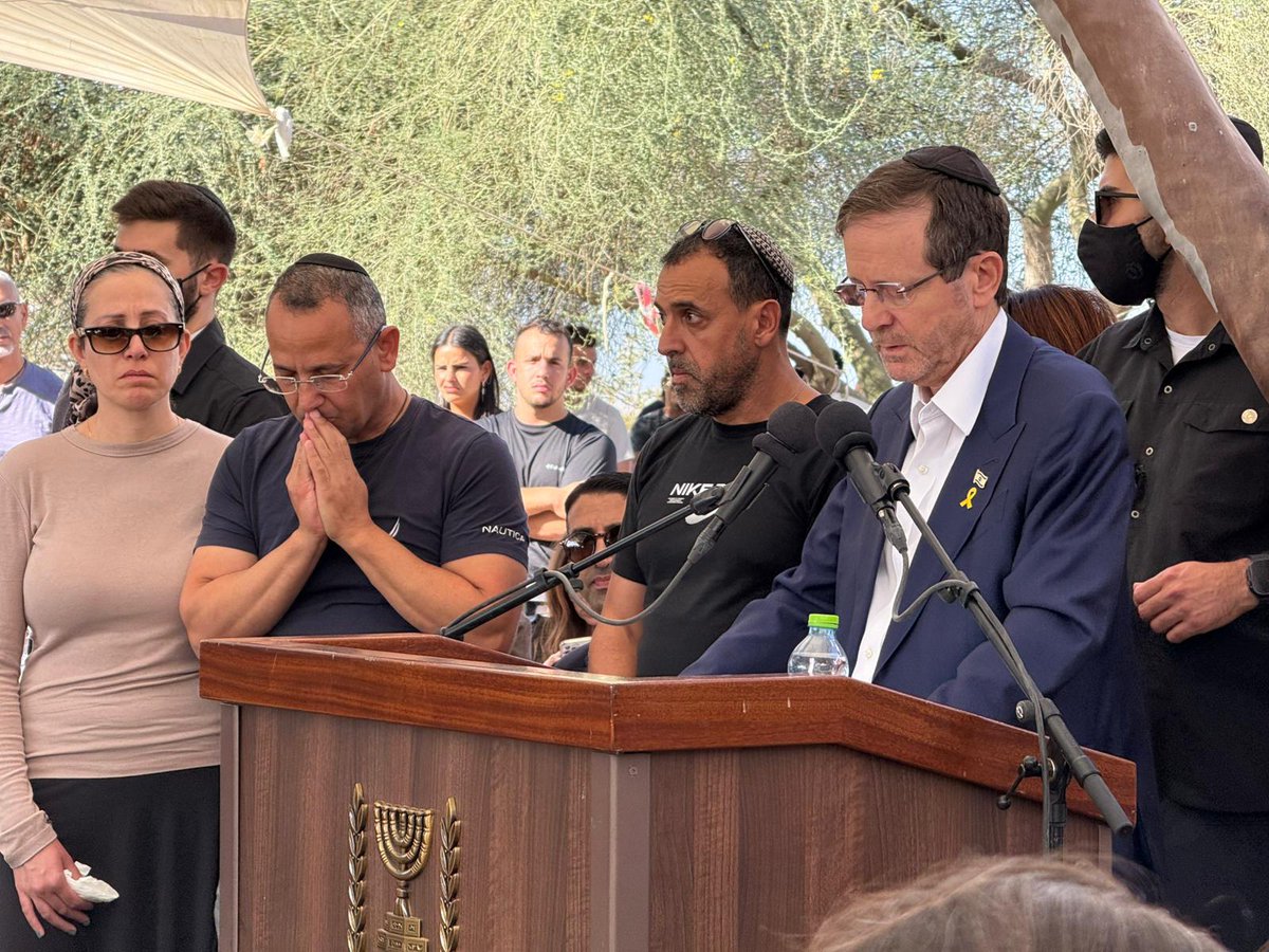 AvivaKlompas's tweet photo. President @Isaac_Herzog at the funeral of Yossi Sharabi.

"As President of the State of Israel, on behalf of the State of Israel and the entire nation, I ask you — Yossi, the Sharabi family, and all of Kibbutz Be’eri — for forgiveness. Forgive us, Yossi, for not saving you, and for not bringing you home sooner. Forgive us for failing to protect you on that cursed day. Forgive us for not standing by your side — against the monsters in human form. Forgive us that it took so long to bring you back to the landscape of your homeland."

📷 Haim Zach /GPO
