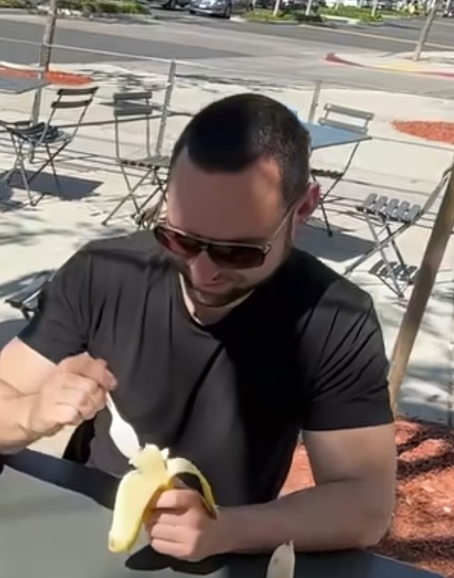 Spoon with a banana? He must've been bullied on how he eats a banana without a spoon.