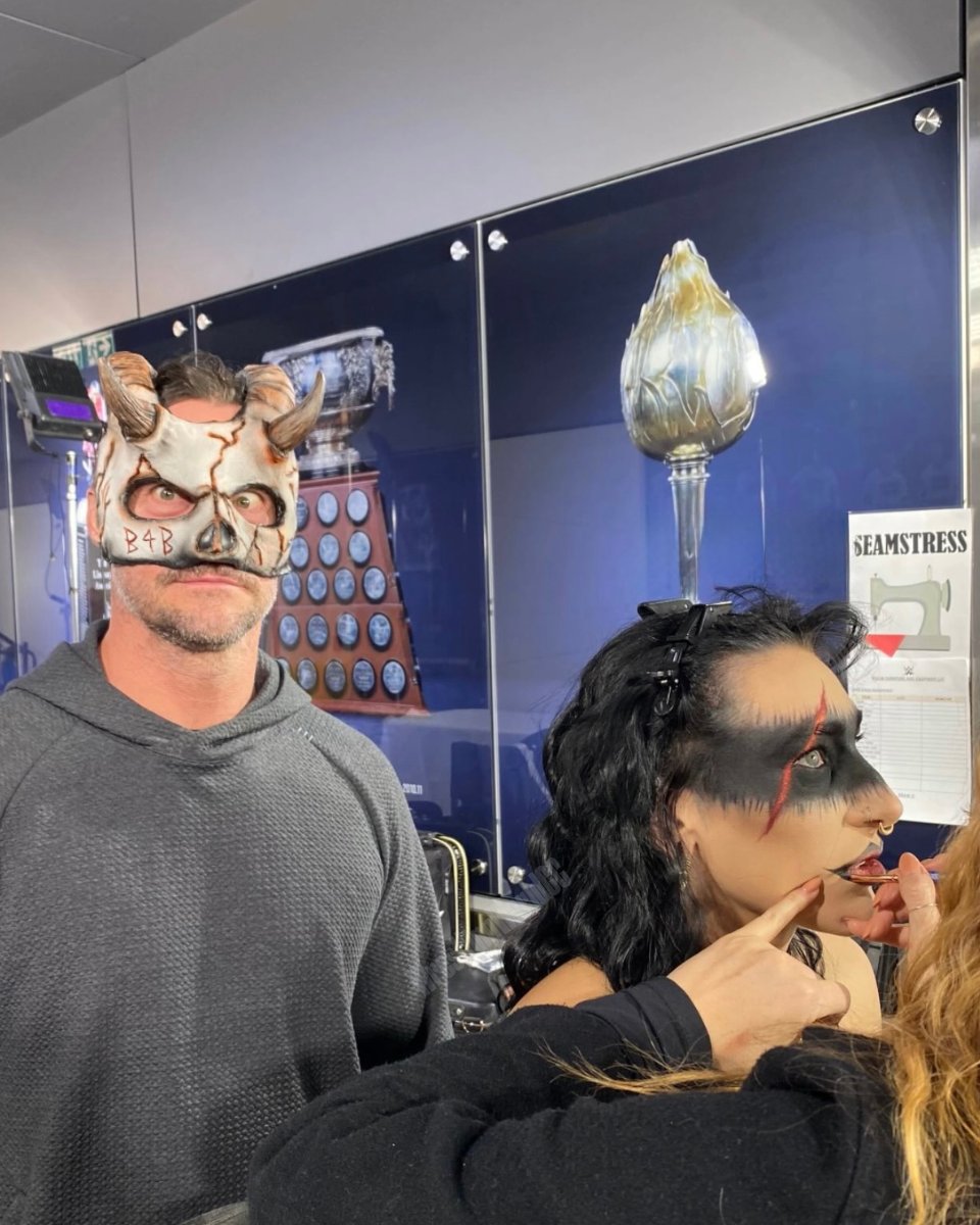WrestlingWCC's tweet photo. CM Punk wearing Rhea Ripley’s face mask 😭 https://t.co/DmhXtDytmF