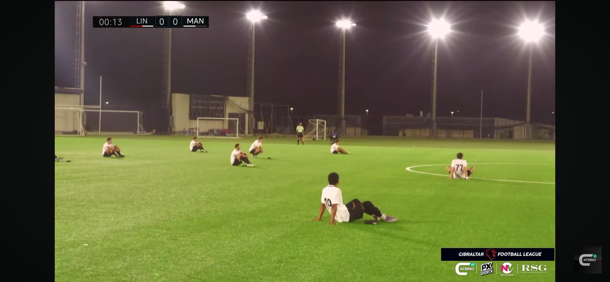 FootballGib's tweet photo. Breaking:

@Man62FC have staged a sit-down protest in the opening 90 seconds or so of their #GFL match vs @LincolnRedImps over allegations of unpaid wages.

#Gibraltar https://t.co/YFOefmR1TG