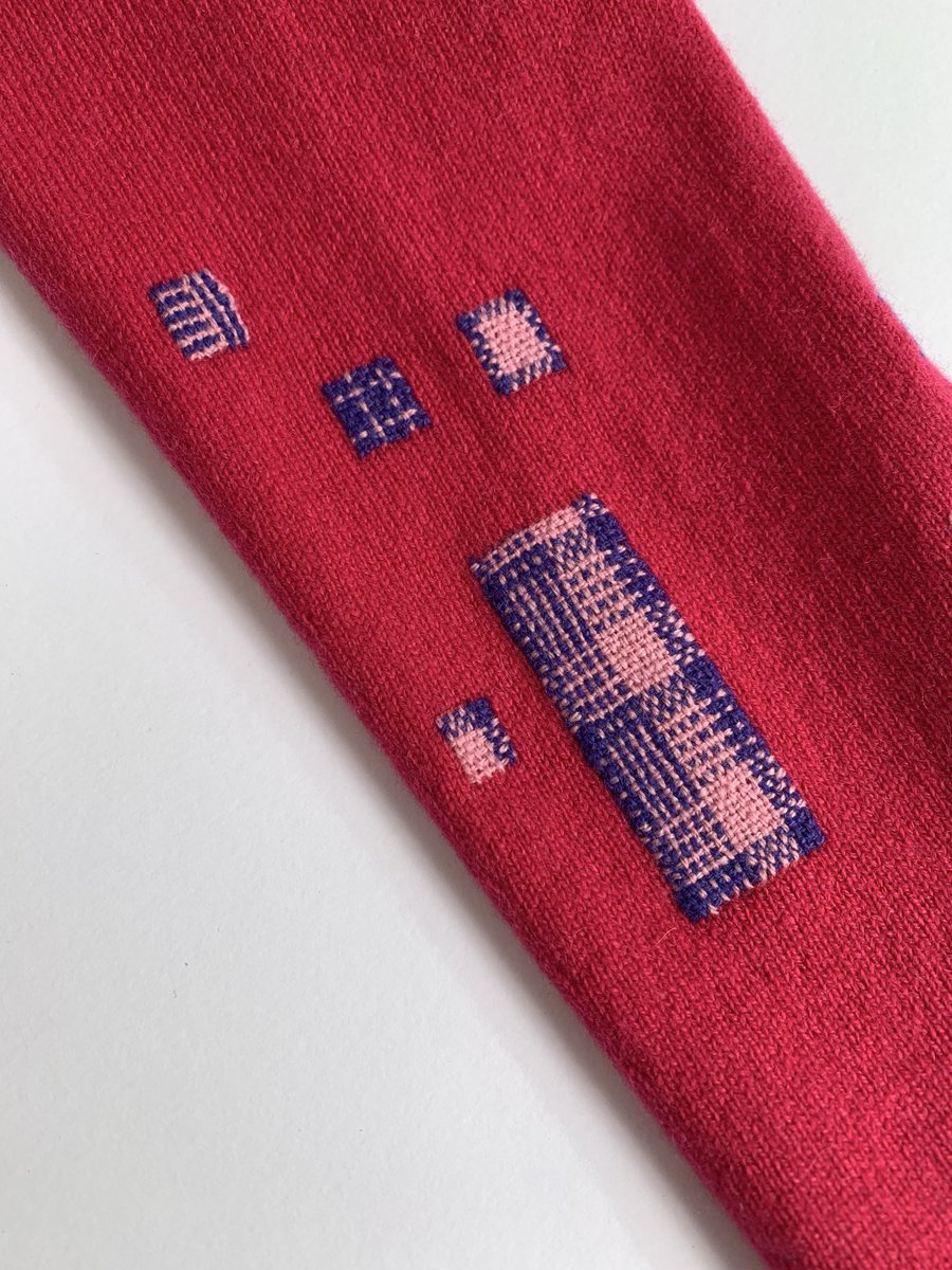 A moth eaten cashmere cardigan, darned with two colours in a range of patterns. 
The silver lining of lots of damage is more design opportunity! 

#visiblemending #darning #repair #makedoandmend #reducewaste #sustainableliving #lovedclotheslast